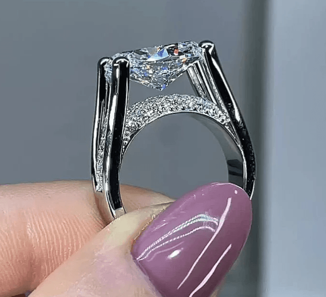 Distinctive Inverted Tension-set Oval Cut Sterling Silver Engagement Ring